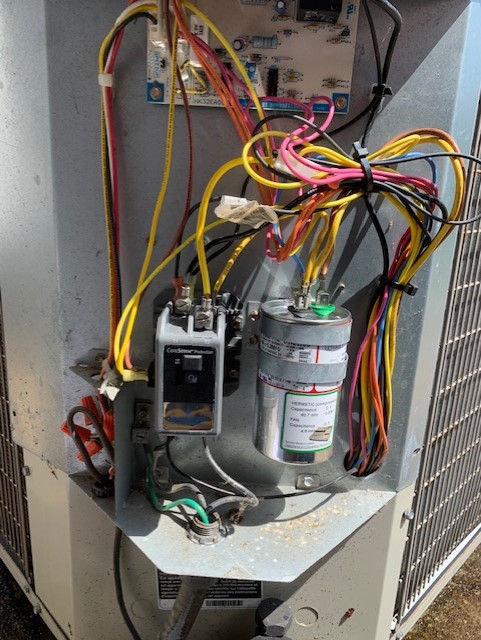 Some parts in your ac unit require replacement over time due to normal wear and tear from daily use such as contactors or capacitors which you can see in this picture.
